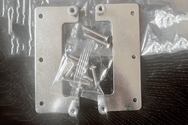 steel hinge reinforcement plate embedded inside heavy door frame