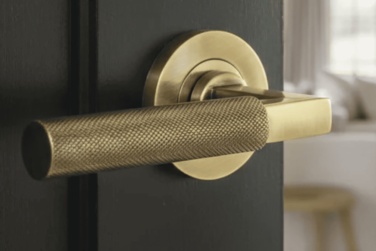 knurled door handles on round rose in satin gunmetal PVD matte black and brushed stainless finishes